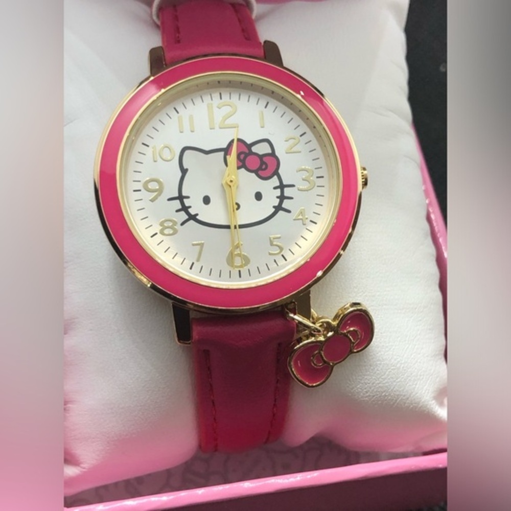 Hello Kitty pink strap gold trim pink charm watch with hello kitty logo face‎